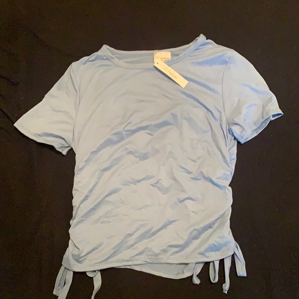 Blue top with tags. Never worn. Size XL